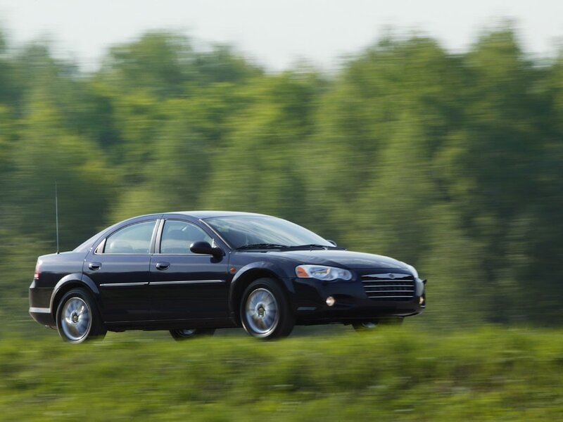 black sedan in motion