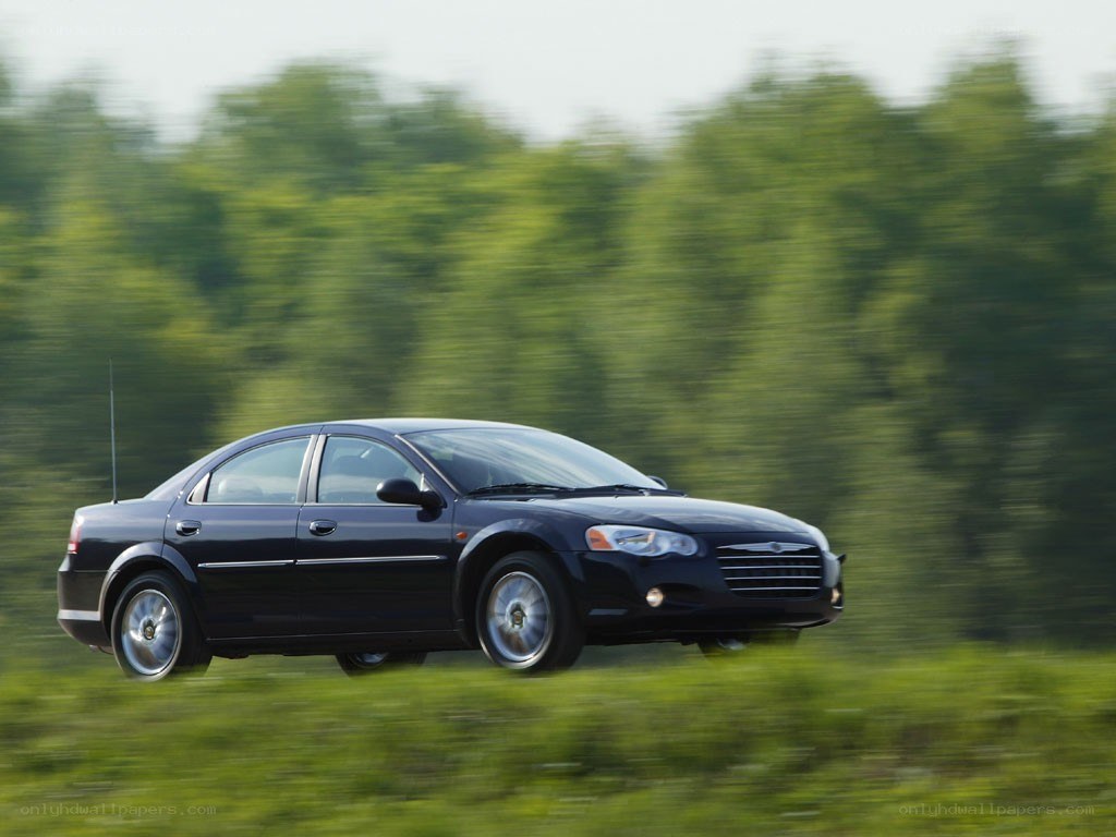 black sedan in motion