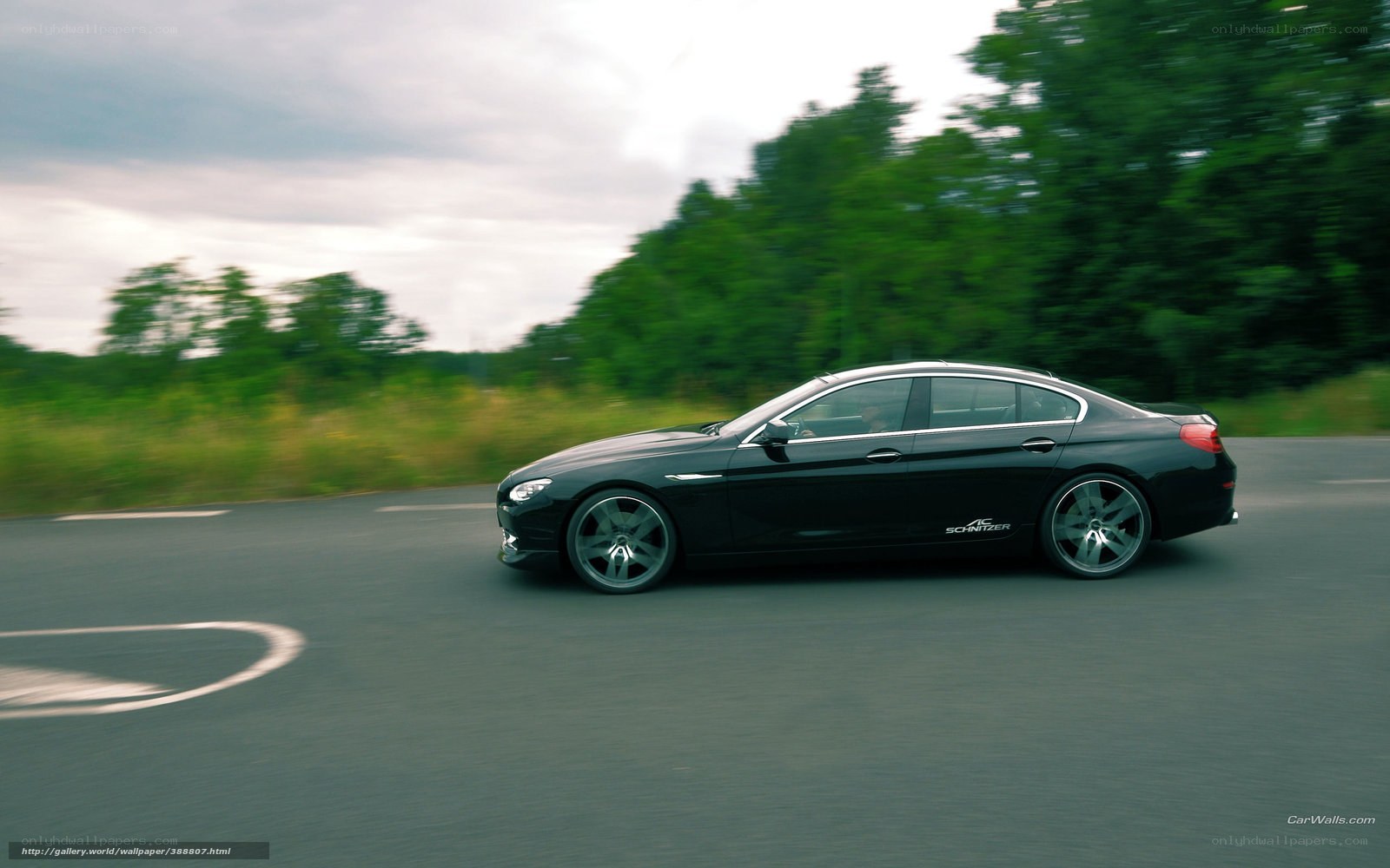 black sedan in motion