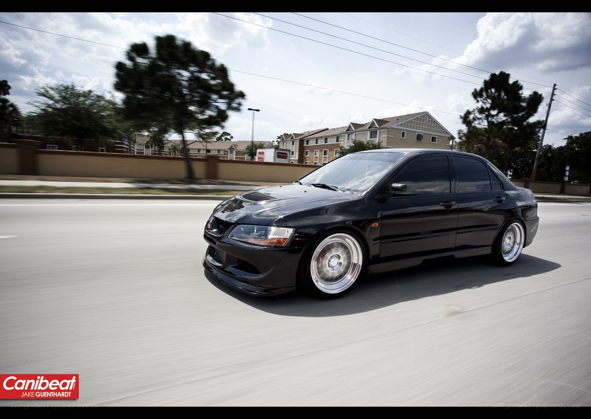 black sedan in motion