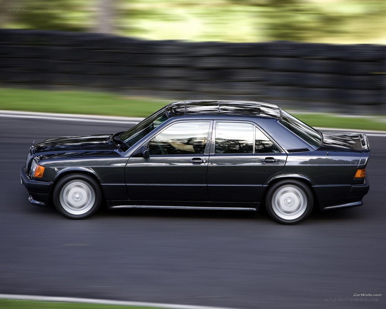 black sedan in motion