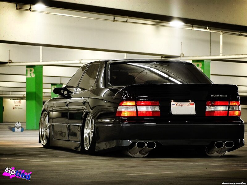 black sedan in parking garage
