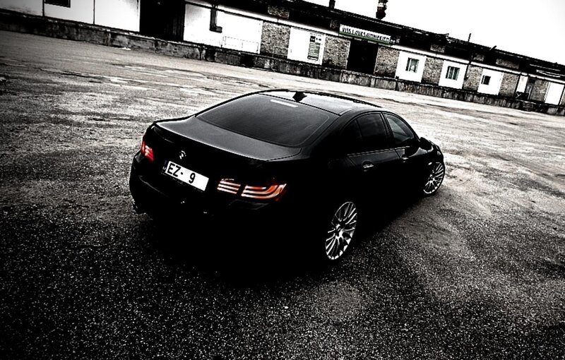 black sedan in parking lot