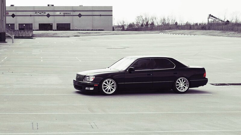 black sedan in parking lot