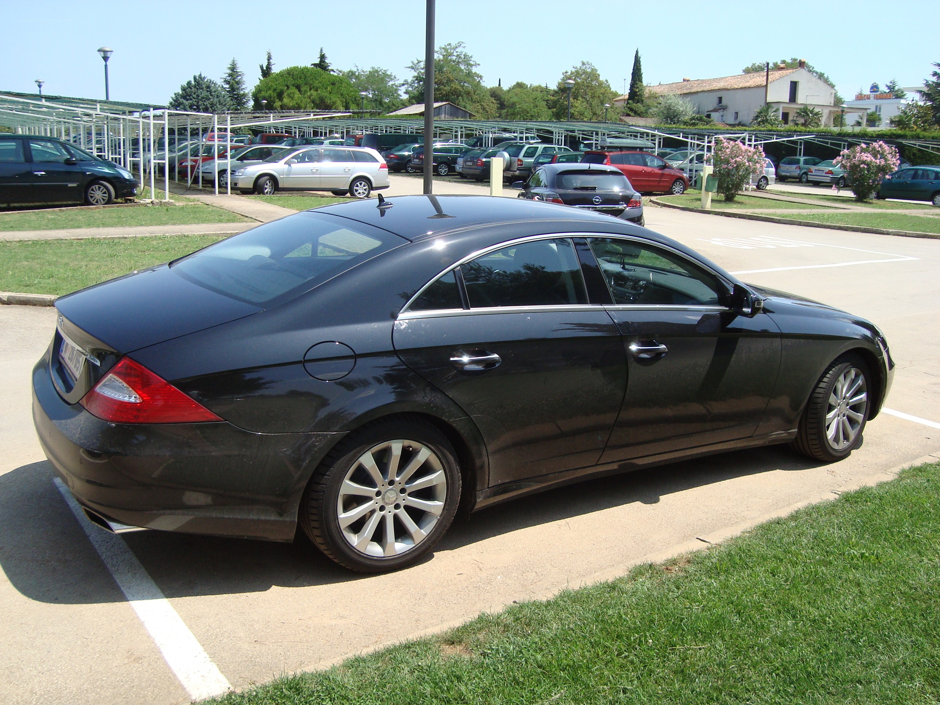 Black sedan in parking lot