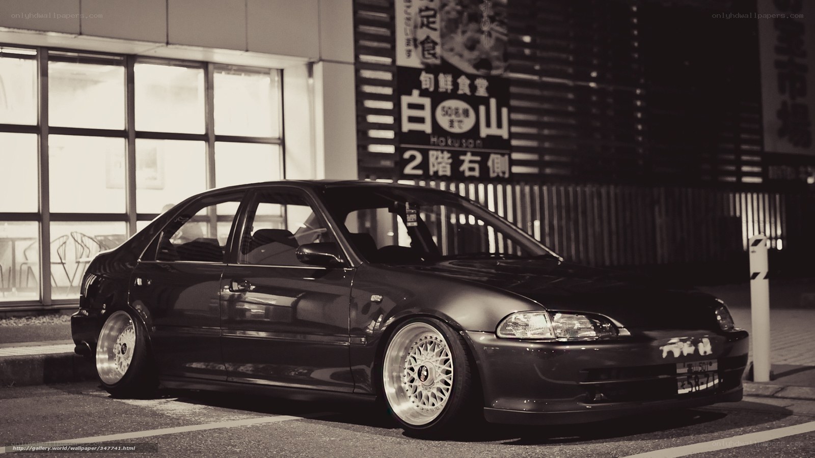 black sedan in parking lot