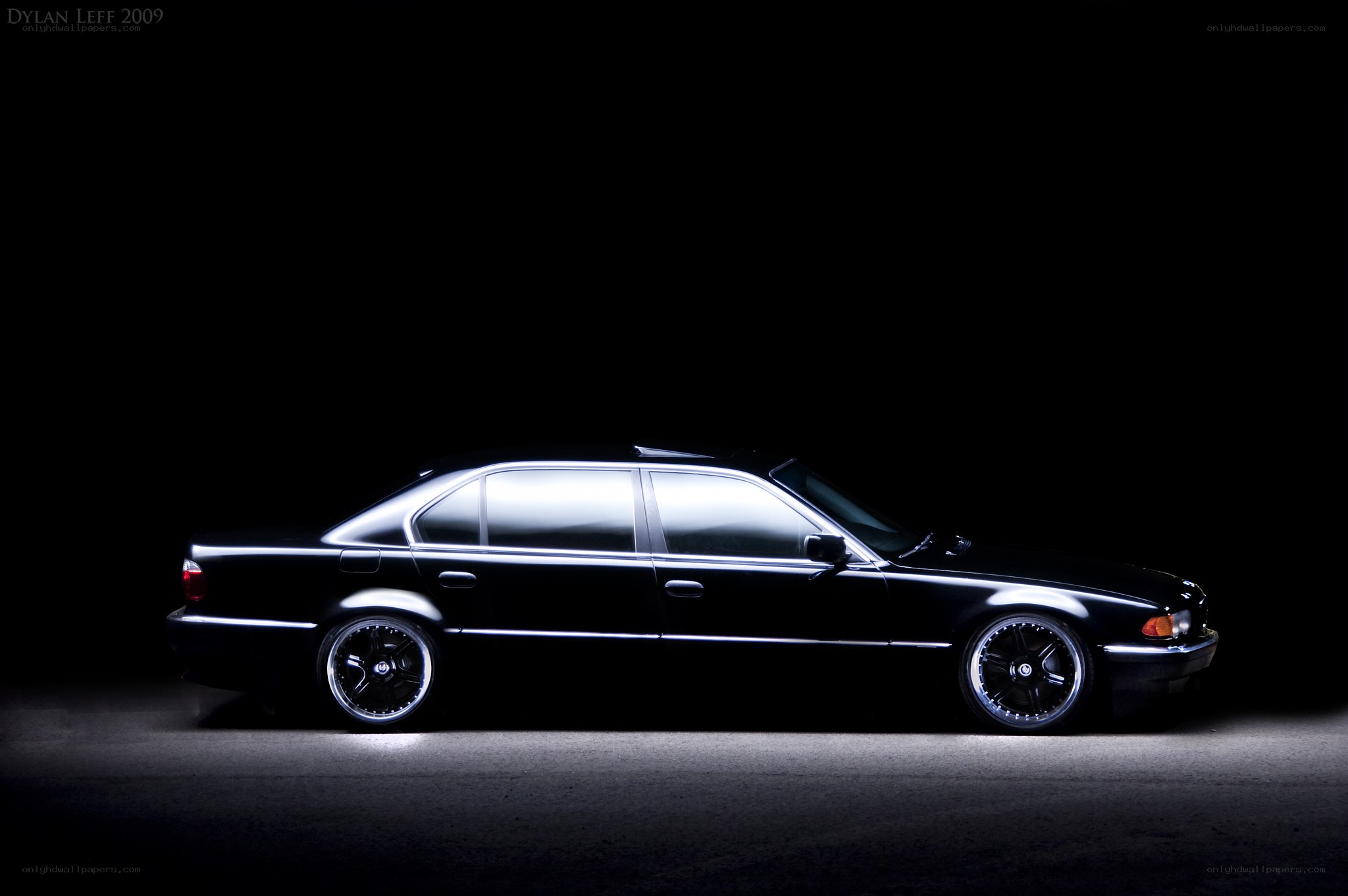 black sedan in spotlight