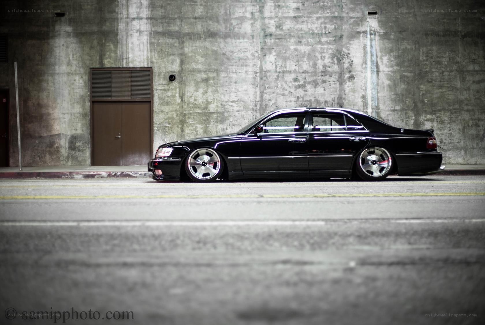 black sedan in urban setting