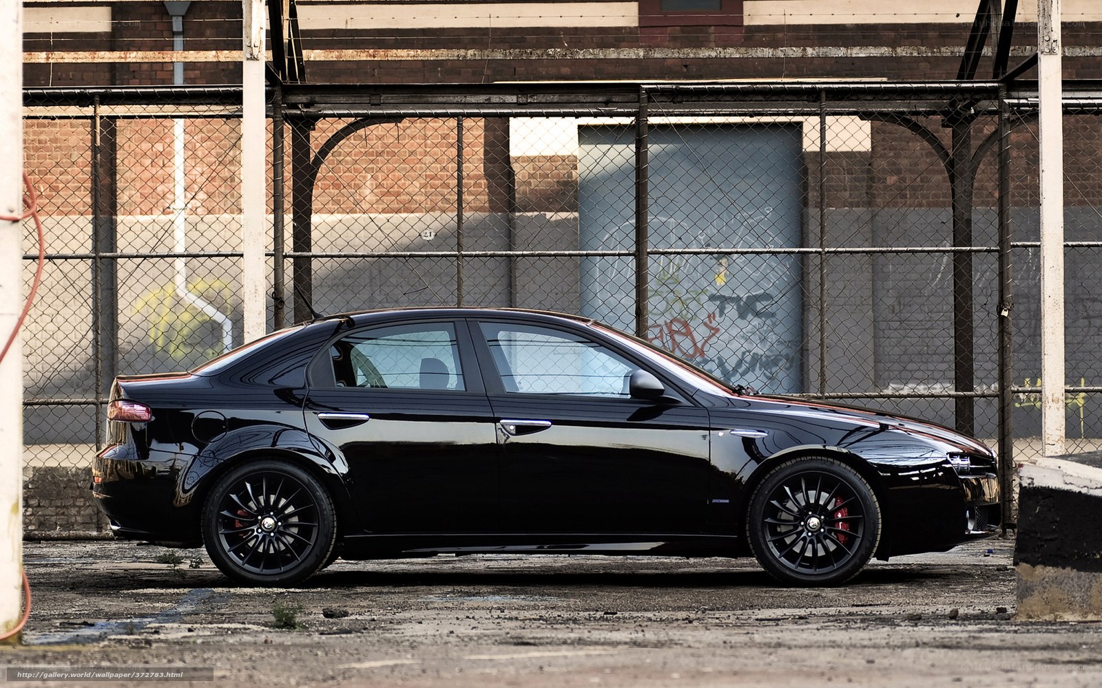black sedan in urban setting