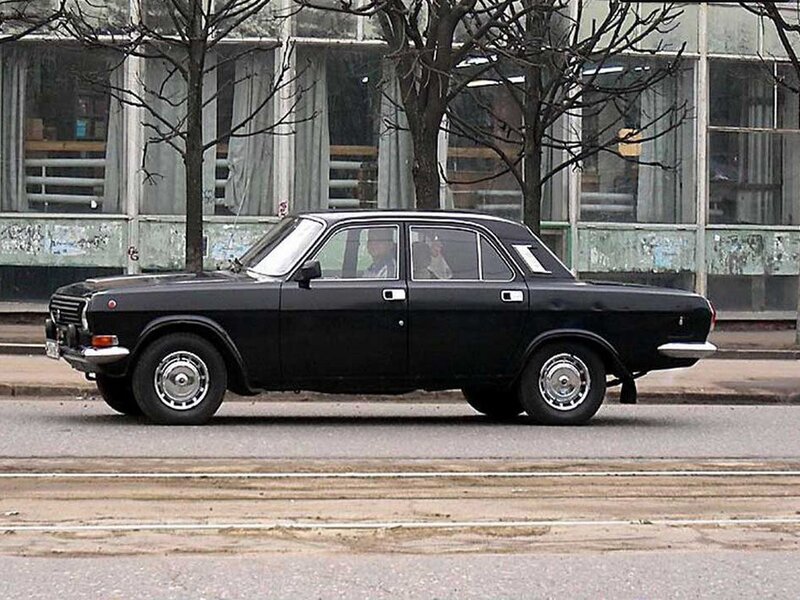 Black sedan on a city street