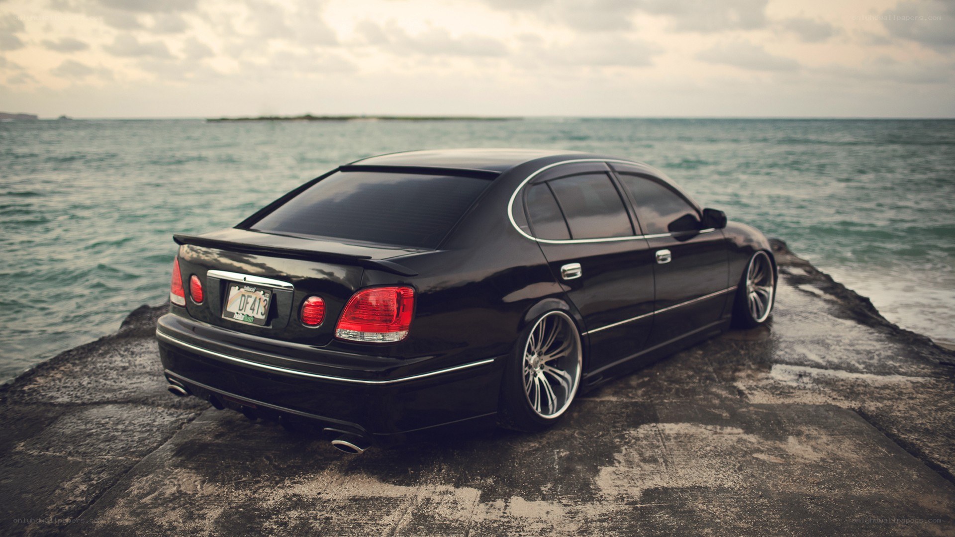 black sedan on a pier