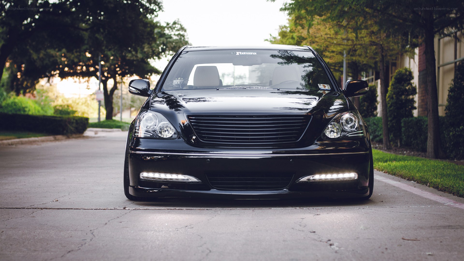 black sedan on a quiet street