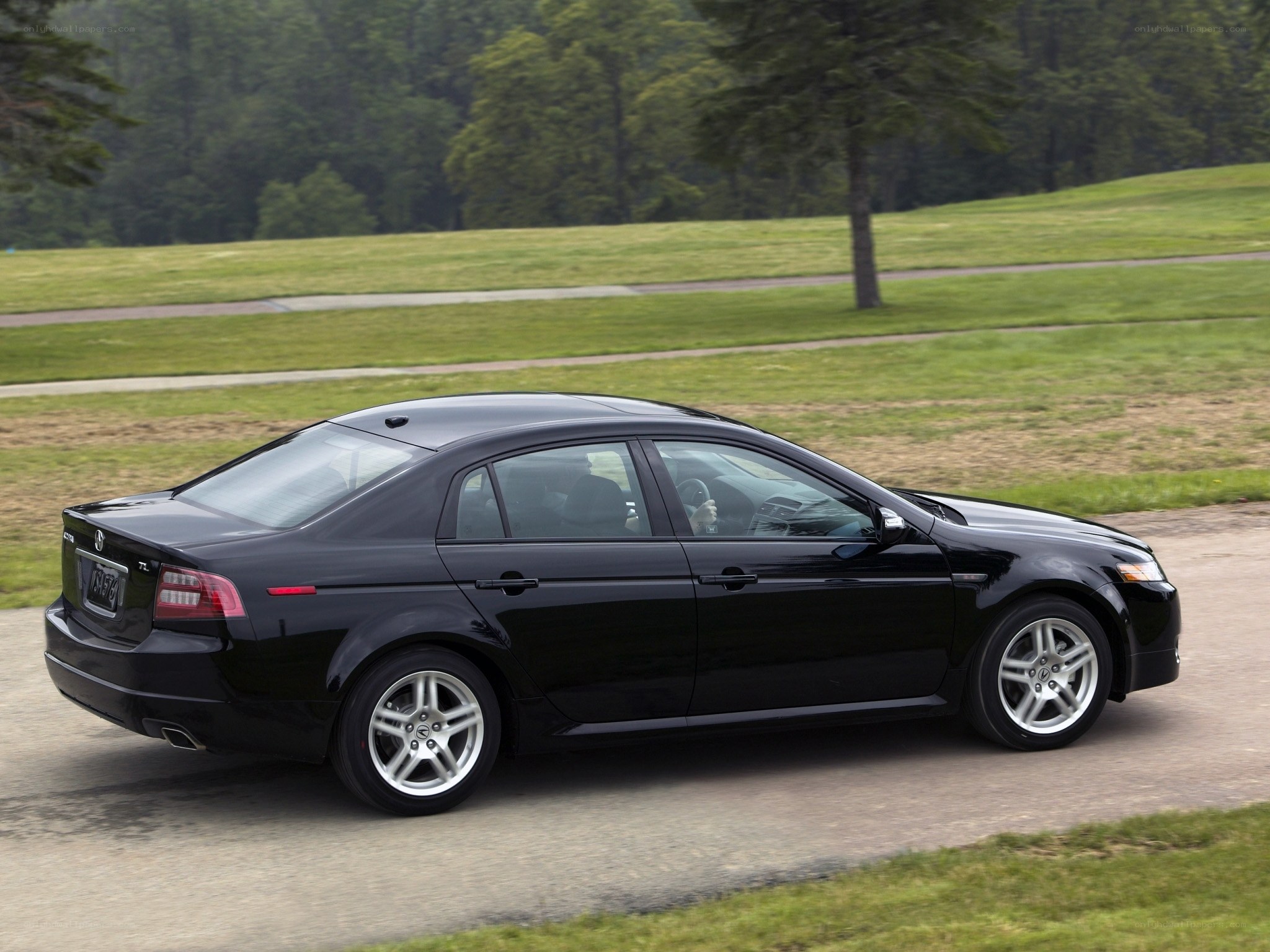 black sedan on a road