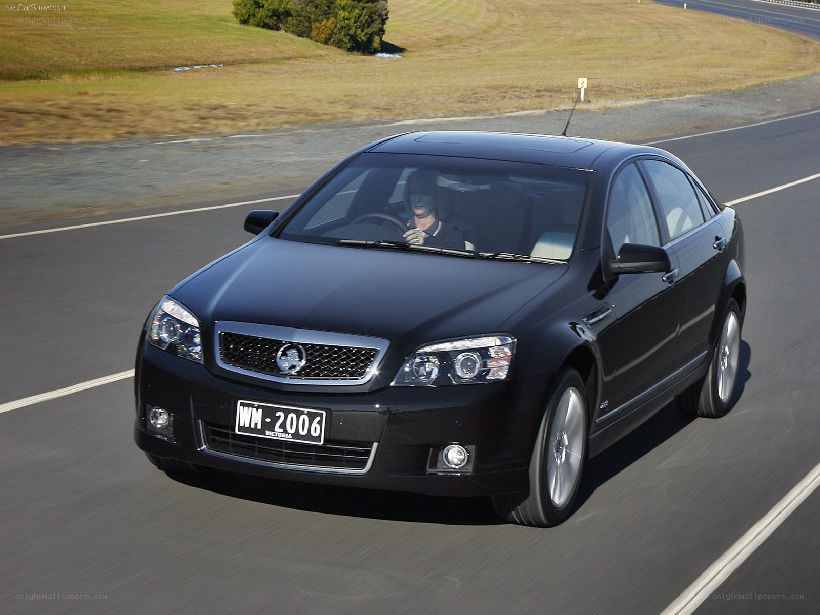 black sedan on a road