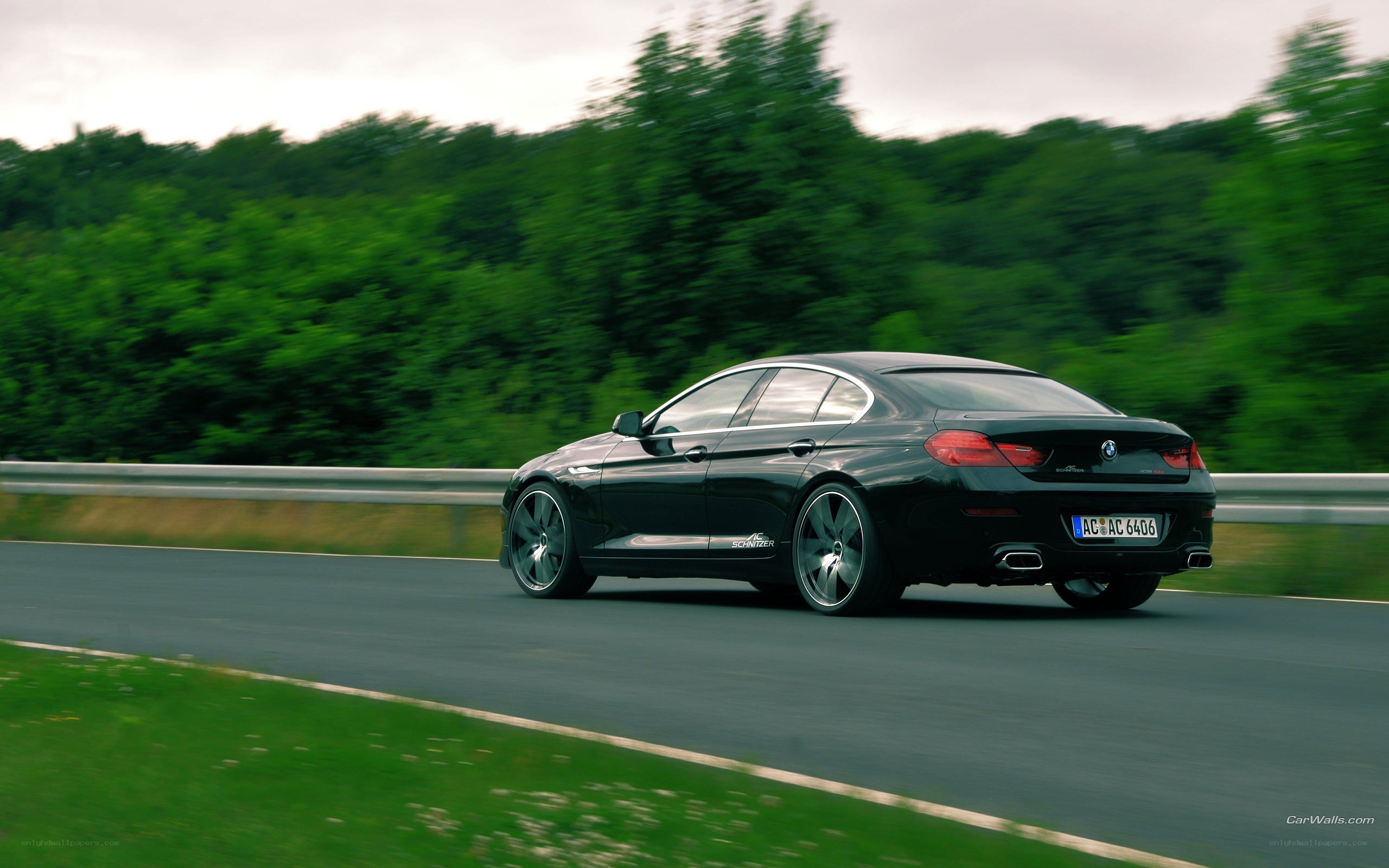 black sedan on a road