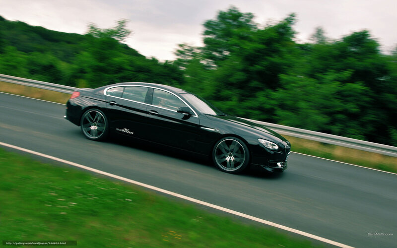 black sedan on a winding road