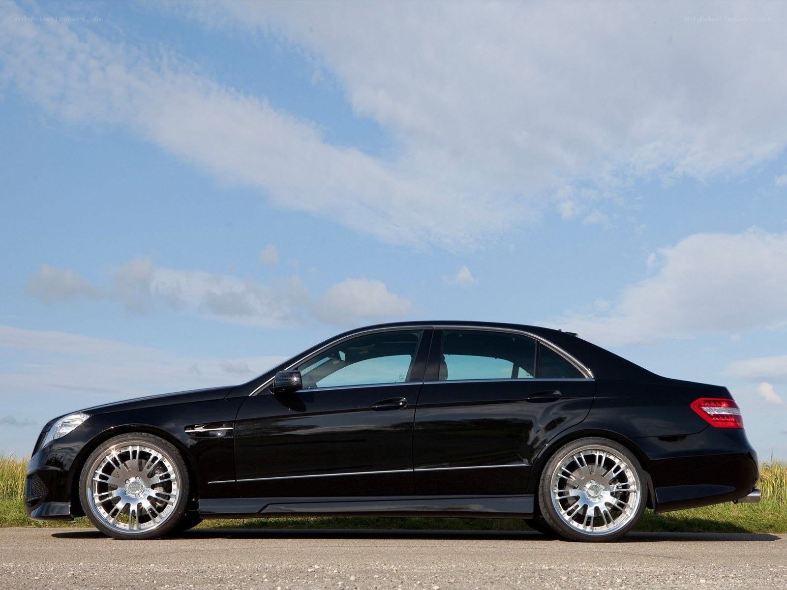 black sedan on asphalt
