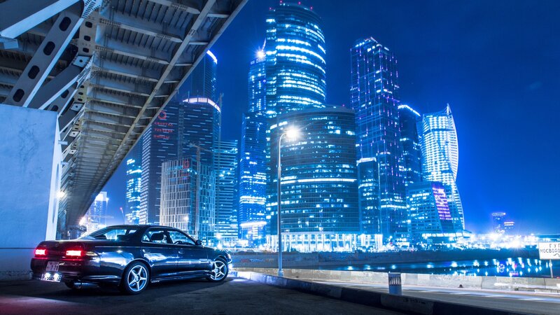 Black Sedan on Bridge