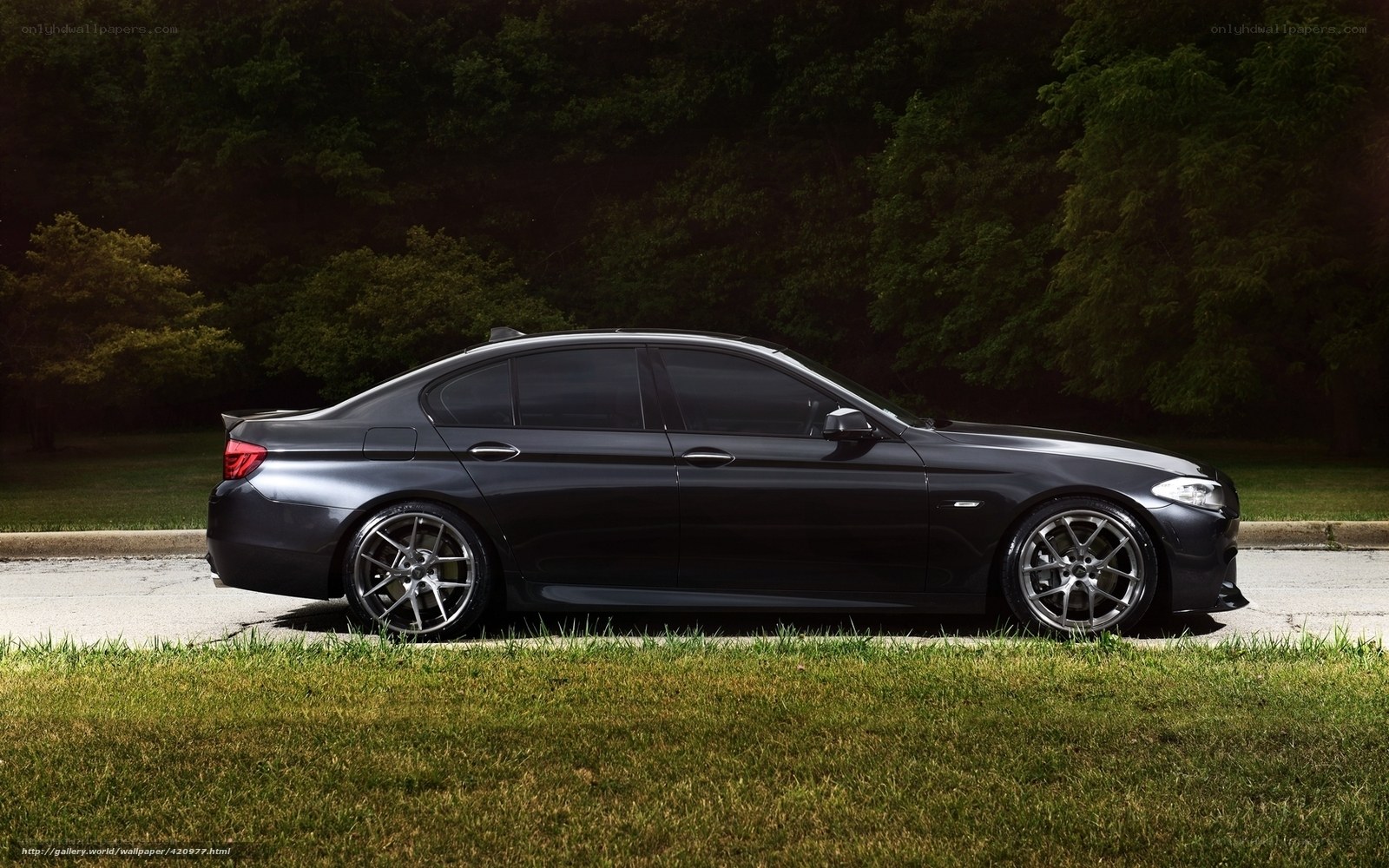 black sedan on grass