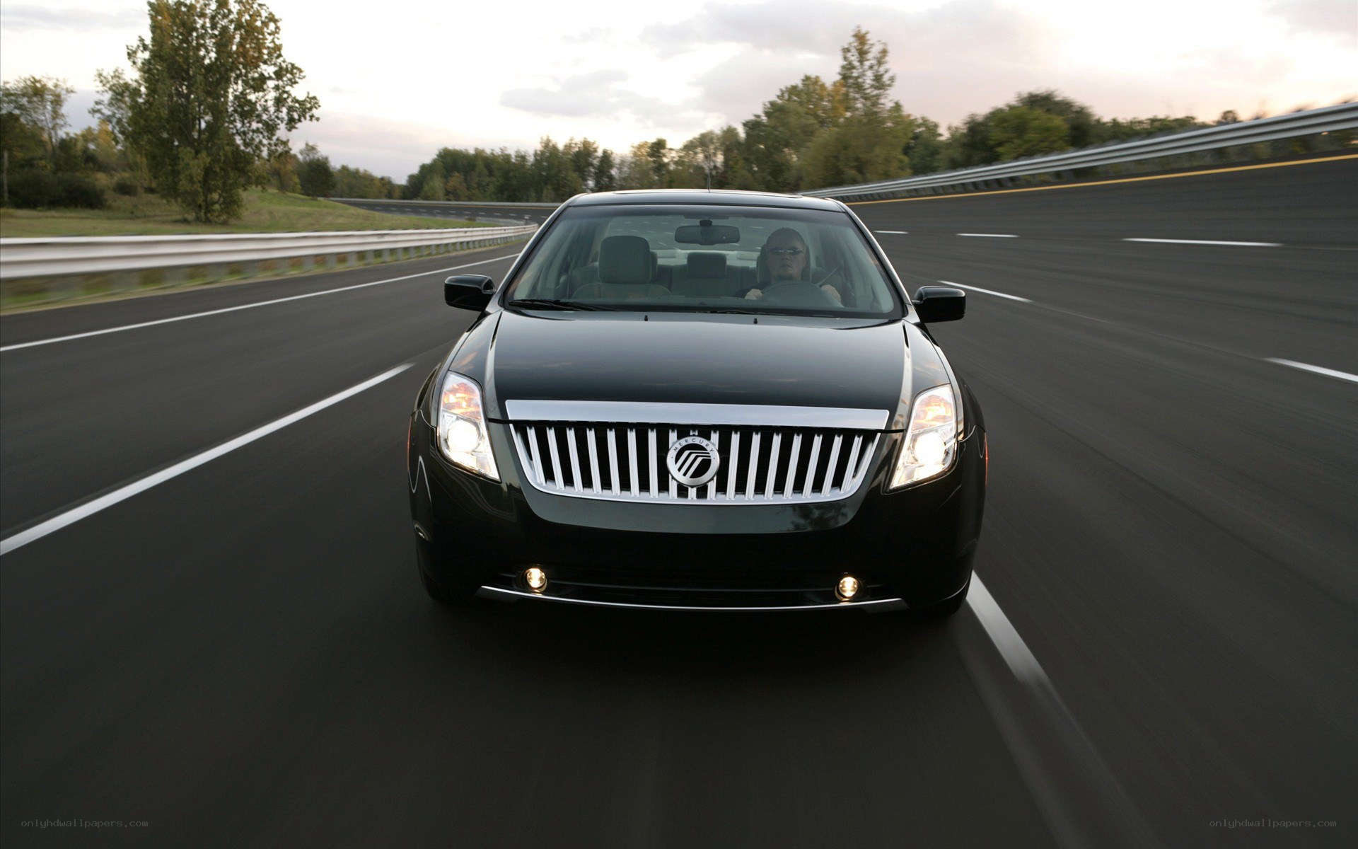 black sedan on highway