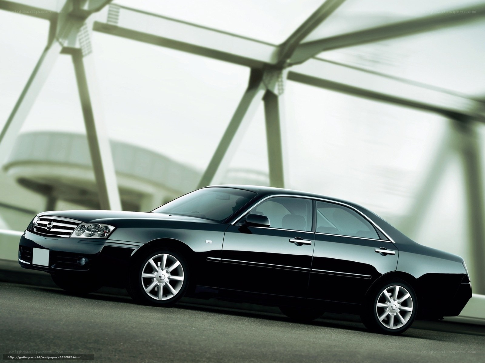 Black sedan on modern bridge