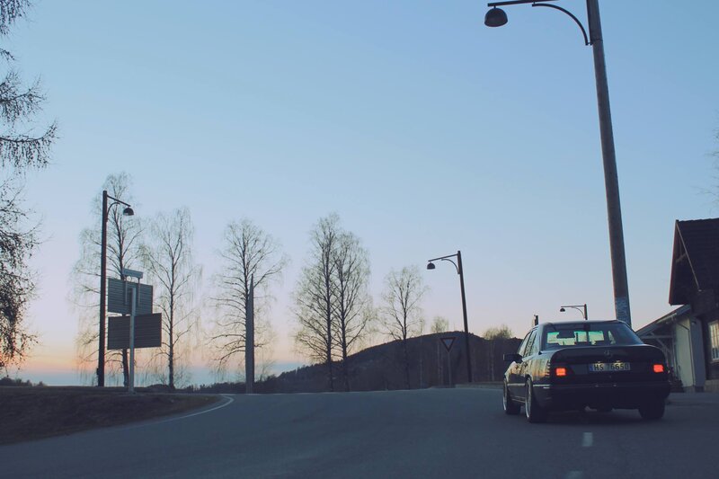 Black Sedan on Road — Blue