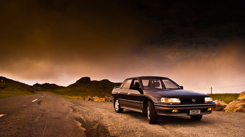 Black Sedan on Road — Brown