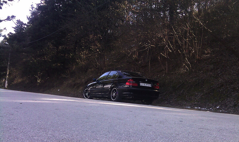 Black Sedan on Road — Calm