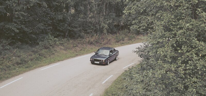 Black Sedan on Road — Green