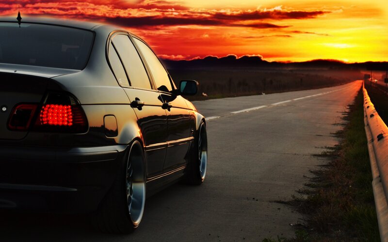Black Sedan on Road — Orange