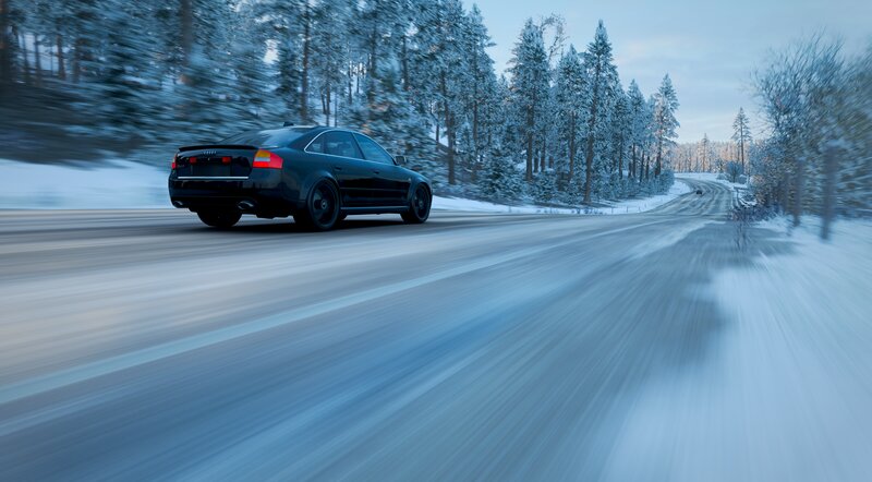 Black Sedan on Snowy Road