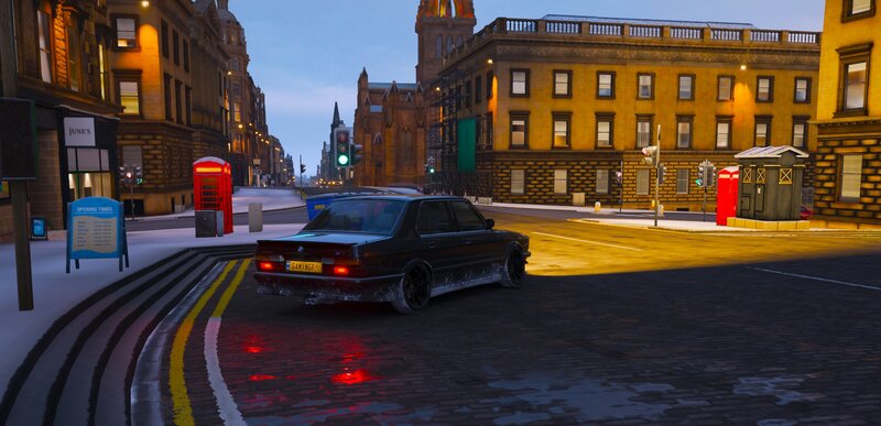 Black Sedan on Street — Yellow