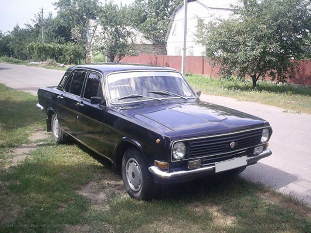 black sedan parked on grass