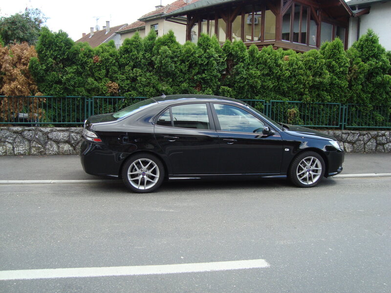 black sedan parked on street