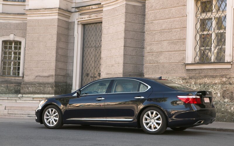 black sedan parked on street