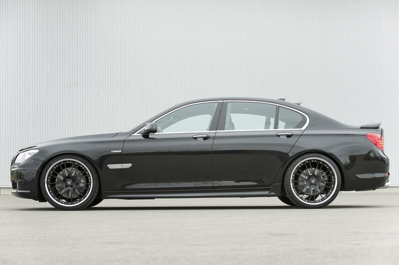 black sedan with custom wheels