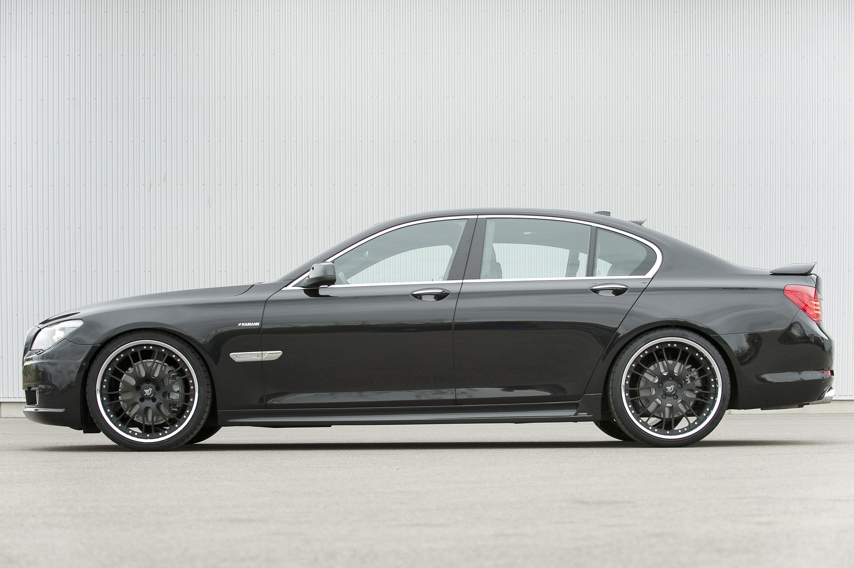 black sedan with custom wheels