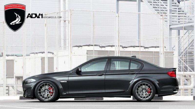 black sedan with custom wheels