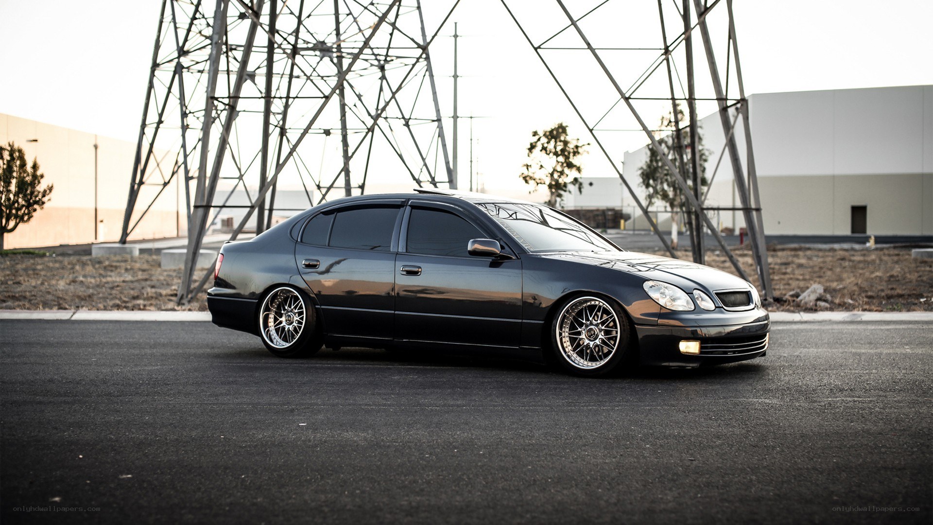 black sedan with custom wheels