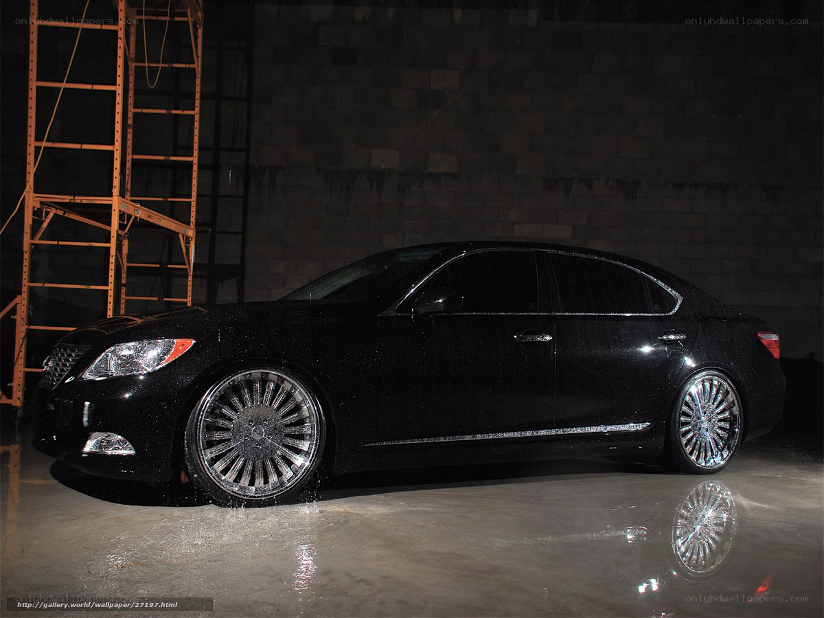 Black sedan with custom wheels