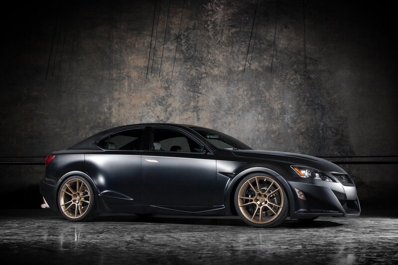 Black sedan with gold wheels