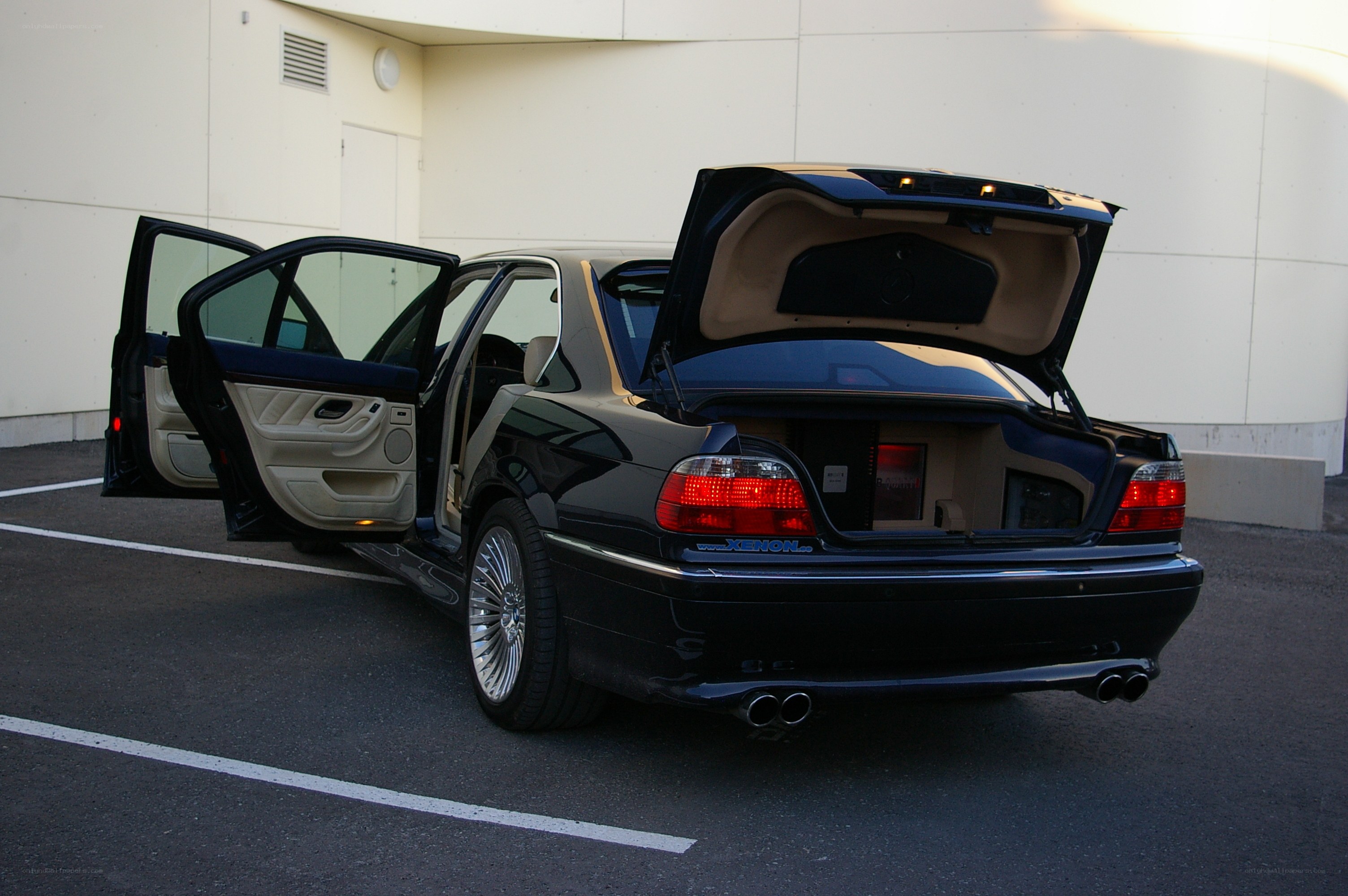 black sedan with open doors