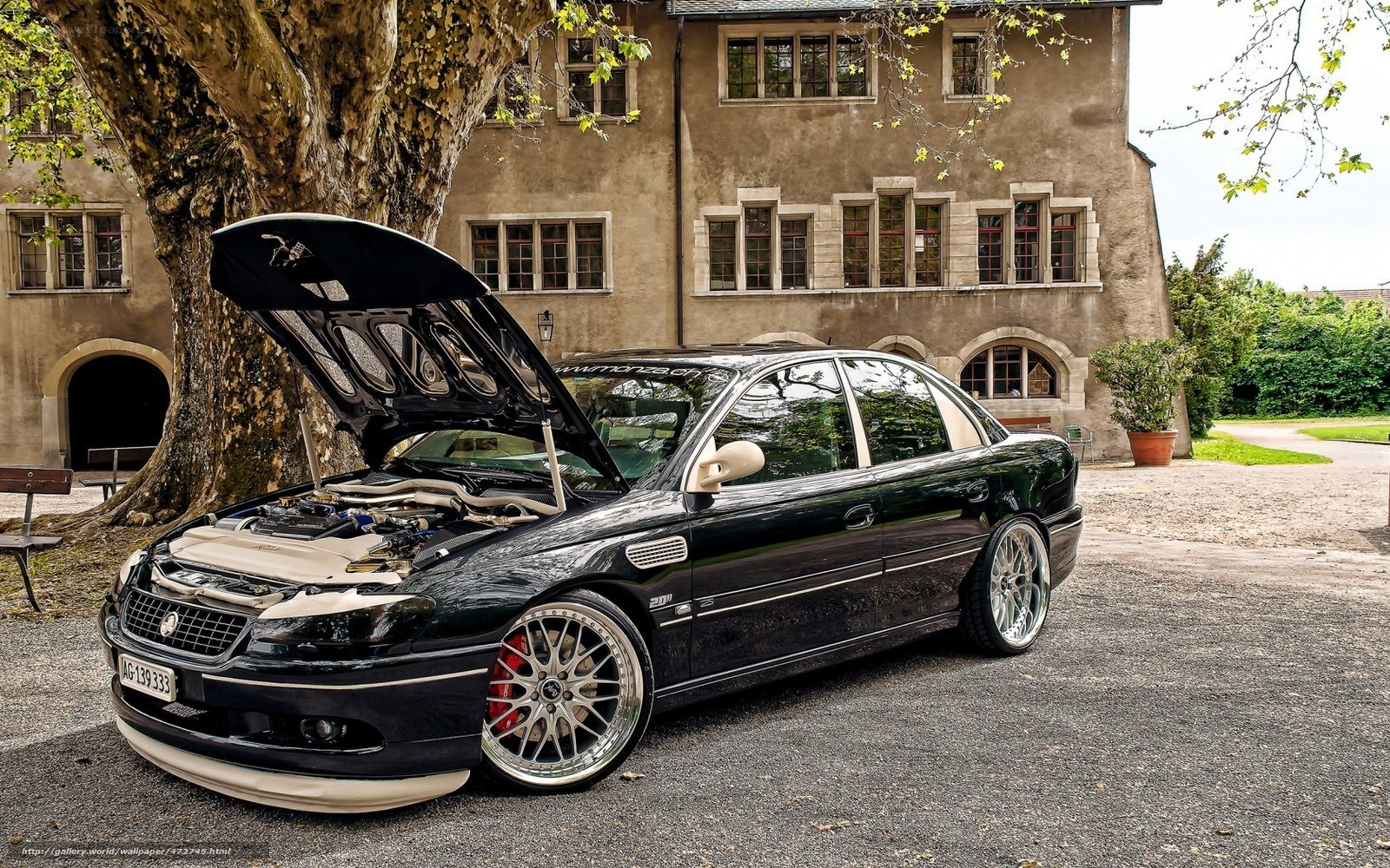 black sedan with open hood