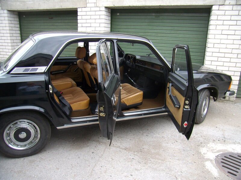 Black sedan with tan interior