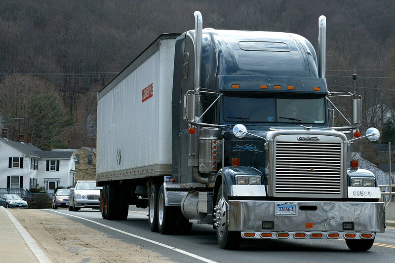 Black Semi-truck on Road — Neutral