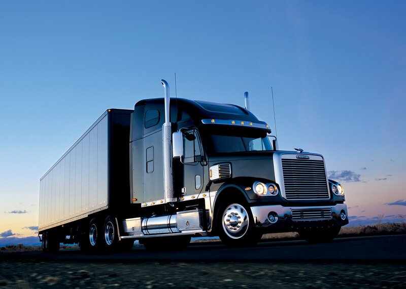 black semi-truck on the road