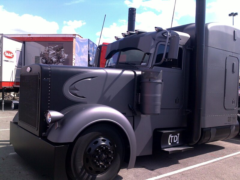 black semi-truck with custom paint