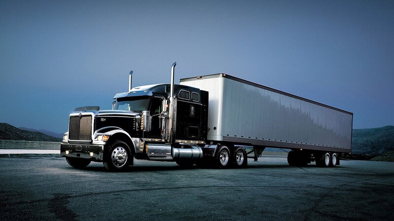 black semi-truck with trailer