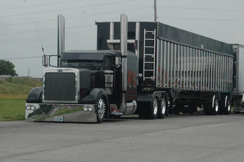 black semi-truck with trailer