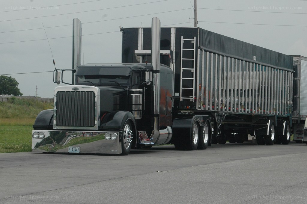 black semi-truck with trailer